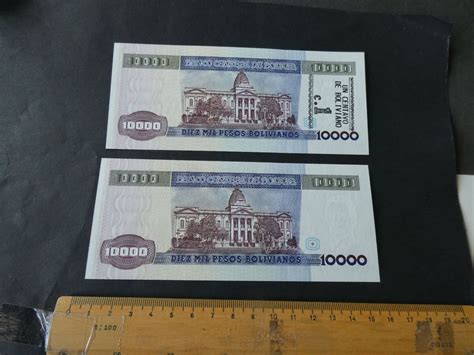 1000 centavos|1000 Pesos .